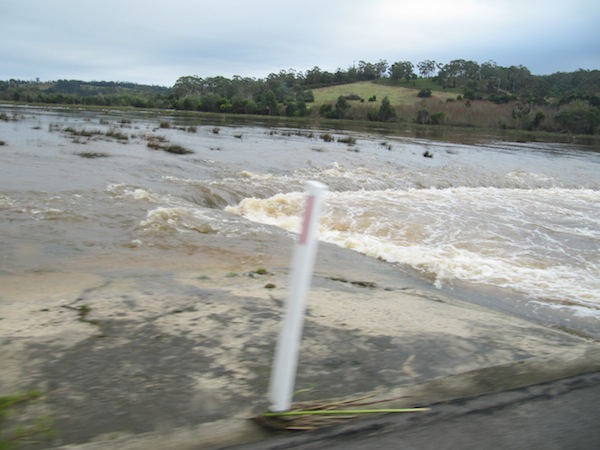 Water surging under a low bridge in Tasmania