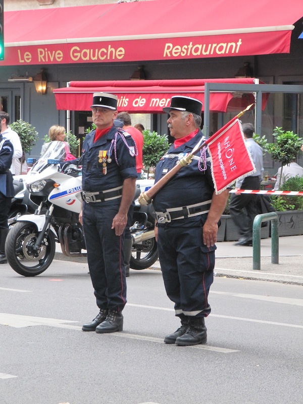 Two senior fire fighters with Rhône banner