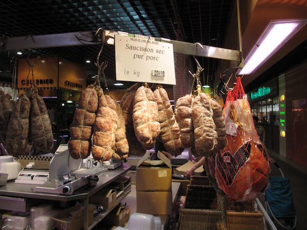Cured meat hanging waiting for its buyer to come along