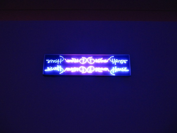 Neon sign with Dream House written on four dimensions