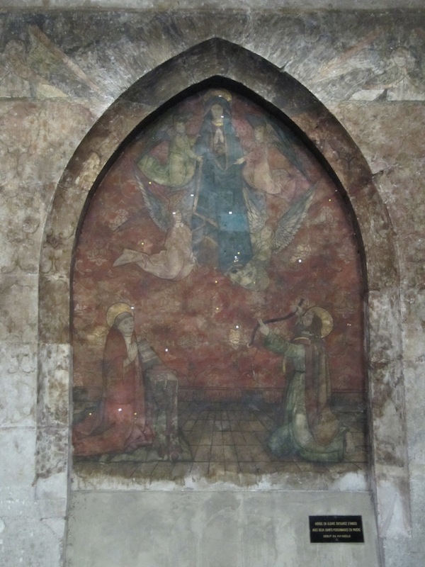 A now faded, once colourful, wall painting.
