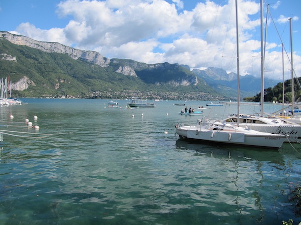 The mountains form a powerful backdrop to the Lake Annecy.