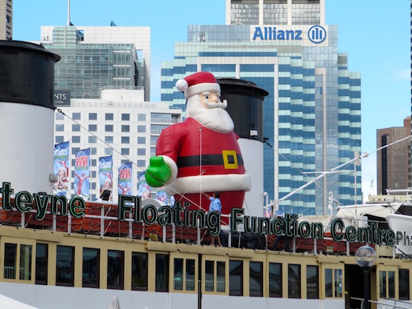 Darling Harbour - Father Christmas looms over a boat