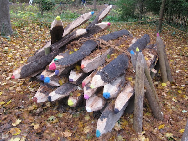 Logs carved into giant crayons.