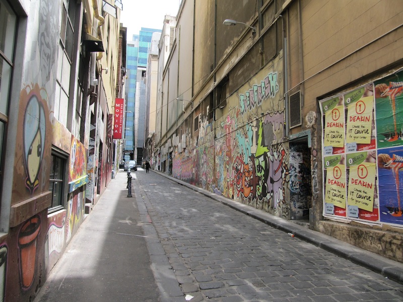 Small street lined with graffiti