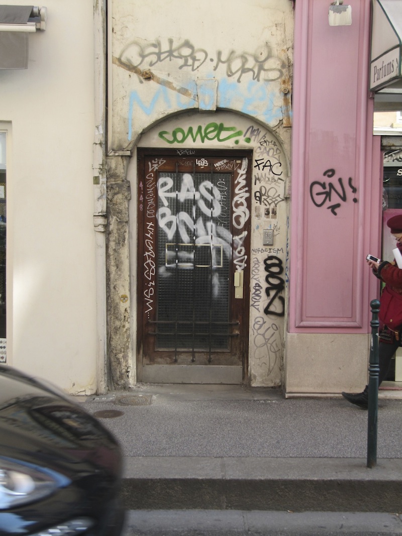 Graffiti covered doorway near Croix Rousse