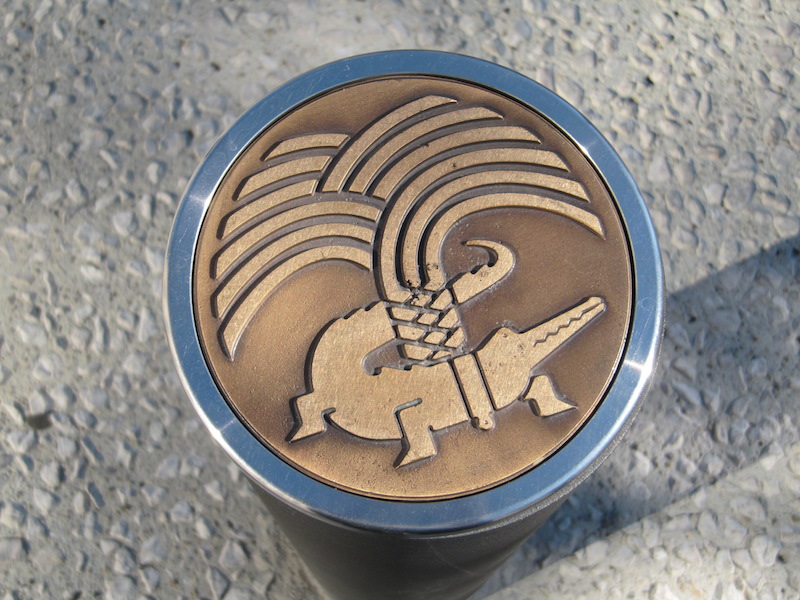 Nîmes symbol on top of a metal pole