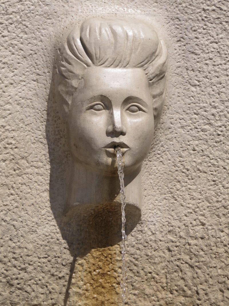 Fountain carved as a female face