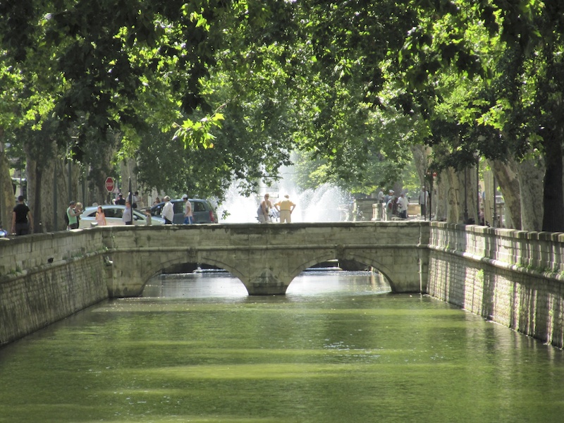 Canal of water leading to a fountain and gardens