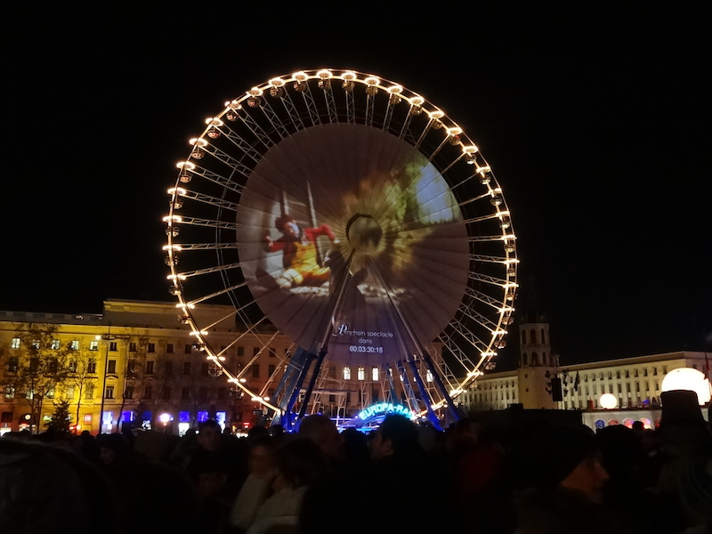 A projection on the side of ferris wheel
