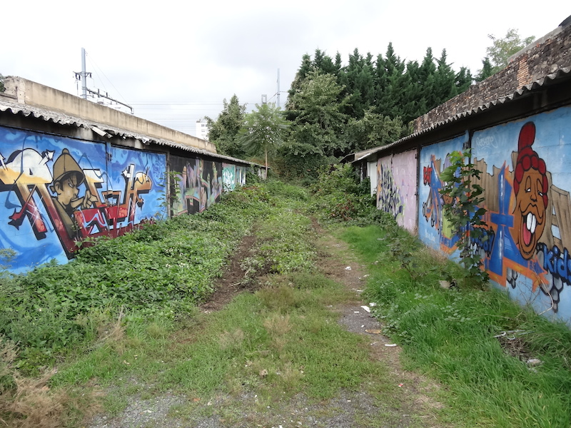 Overgrown garages and graffiti