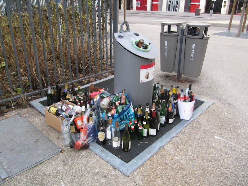 Overflowing glass recycling point