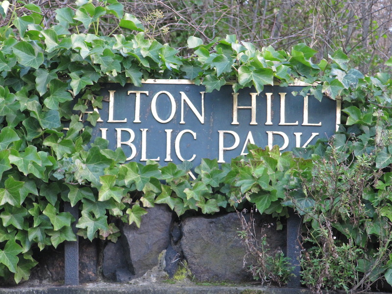 Partially obscured sign to Carlton Hill Public Park