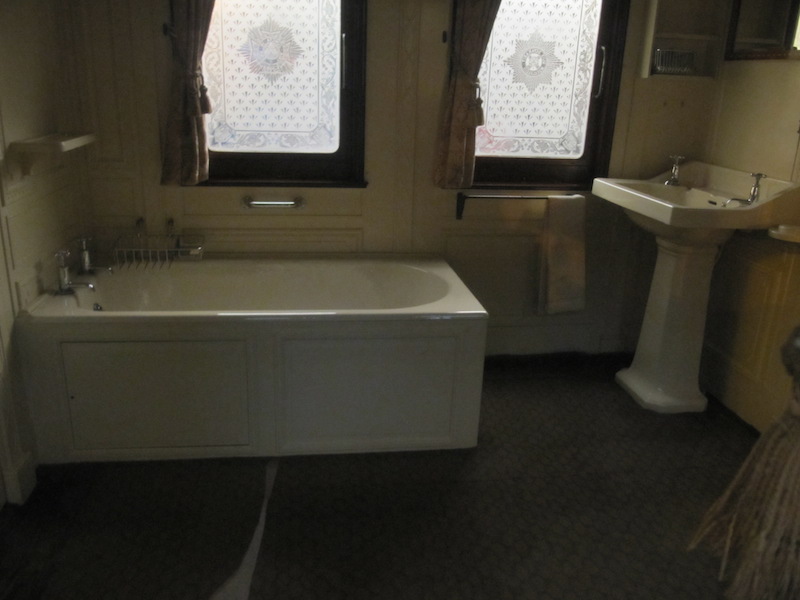 A full bathroom within a royal carriage