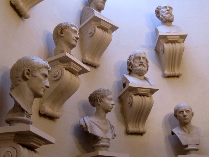 A collection of busts fills a stairwell