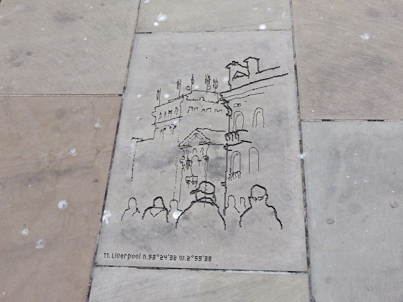 Digital pixel art carved into stone