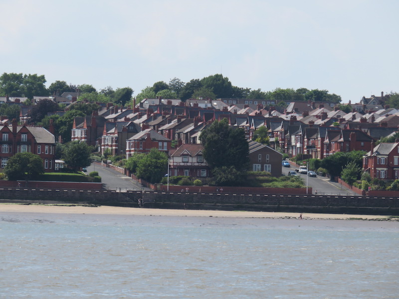 Neat rows of houses descend almost to the water&rsquo;s edge