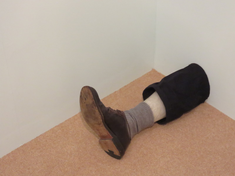 A leg extending out from a wall