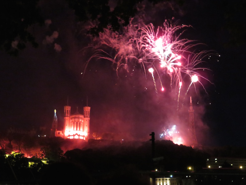Fireworks explode over the Lyon skyline.