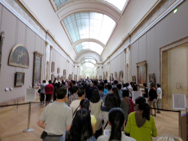 Crowds pass masterpieces with single-minded purpose