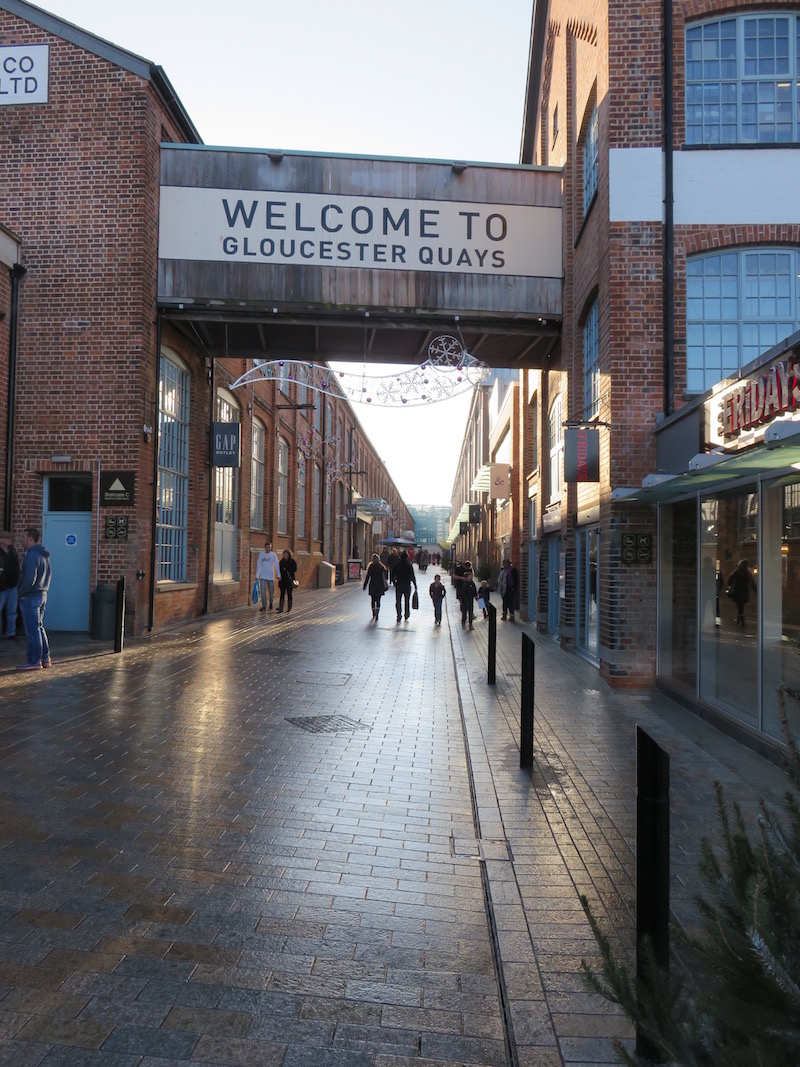 A sign reads &ldquo;Welcome to Gloucester Quays&rdquo;
