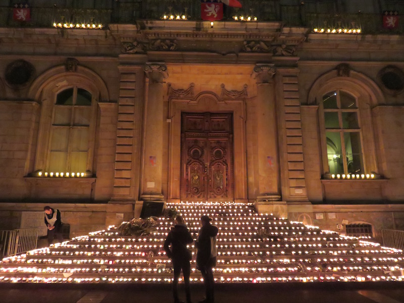 Candles, left by visitors, at the town hall.