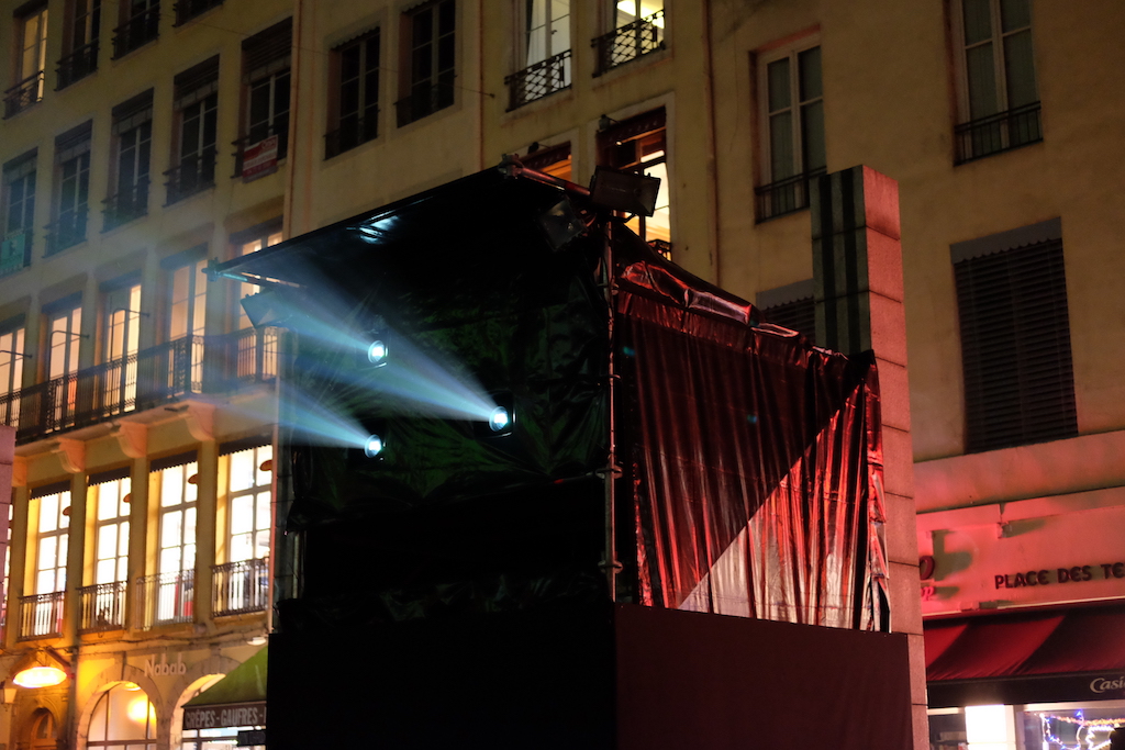 A projector shines out in Place des Terreaux