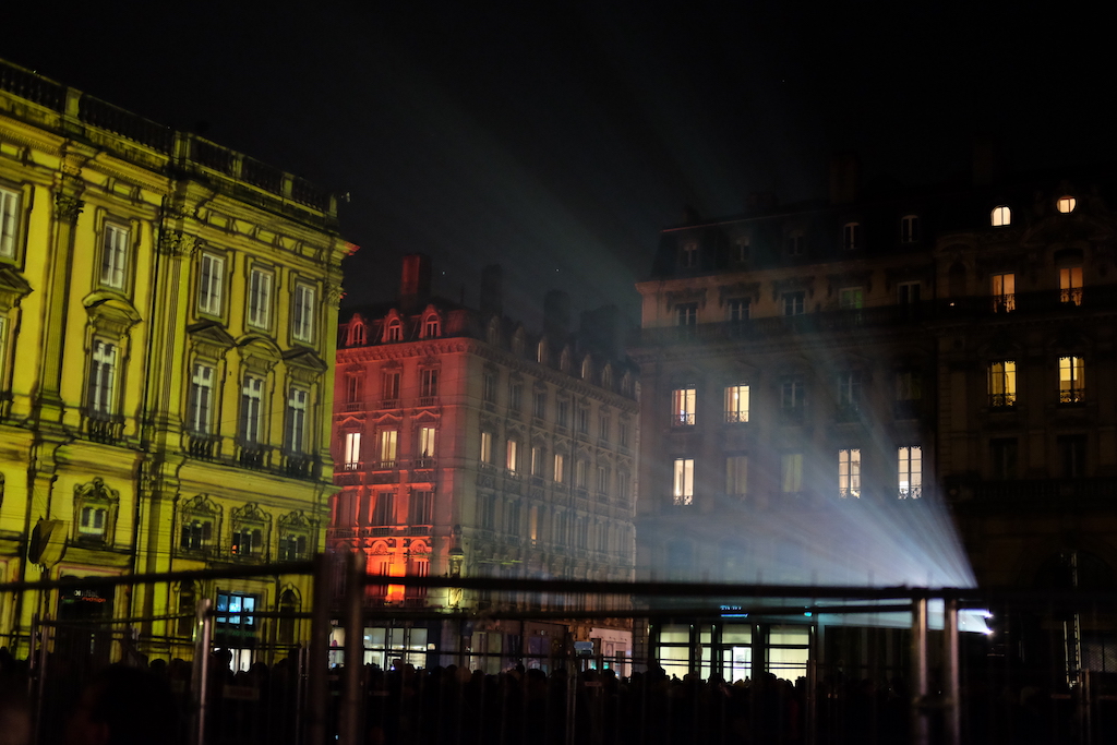 A projector shines out in Place des Terreaux