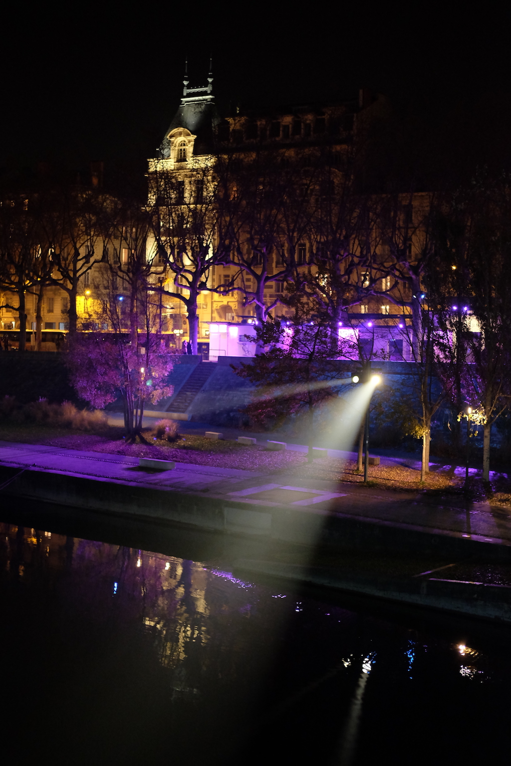 Lights shine out over the River Rhône.