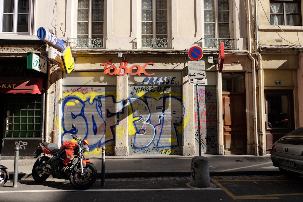 Tabac hoarding covered in graffiti 