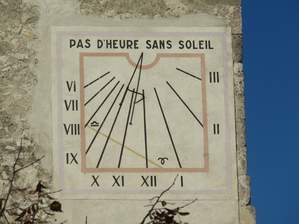 Wall mounted sundial in Charroux
