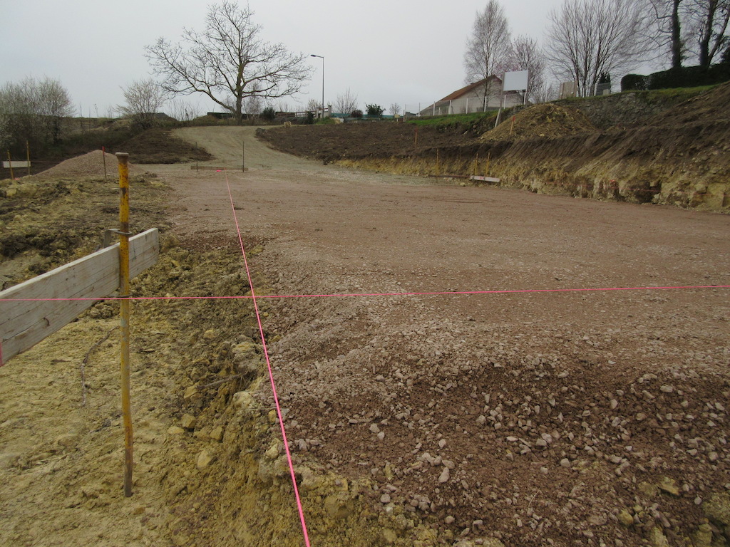 Pink string marks the outline of the house