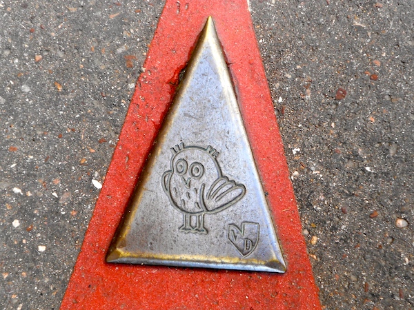 Owl plaques guide the way around Dijon.