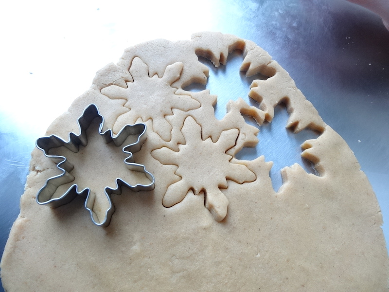 Cutting out the dough with our snowflake cookie cutter