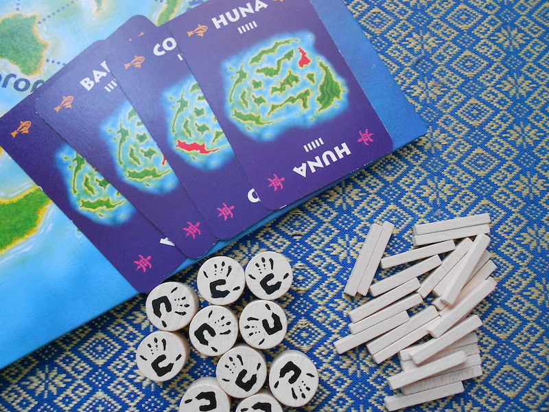 Kahuna cards and pieces. The cards are sturdy, and the pieces are made of wood.
