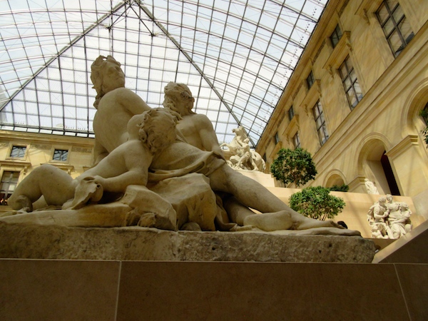 Louvre sculpture gallery under one of the pyramids